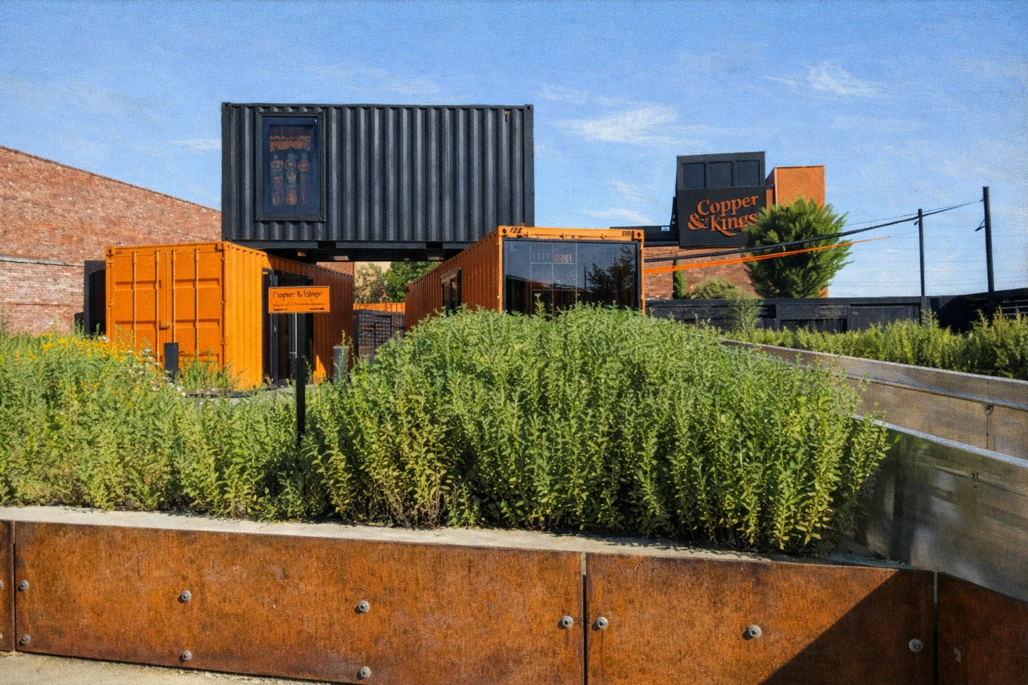 Shipping container gift shop at Copper & Kings Distillery with modern industrial design.