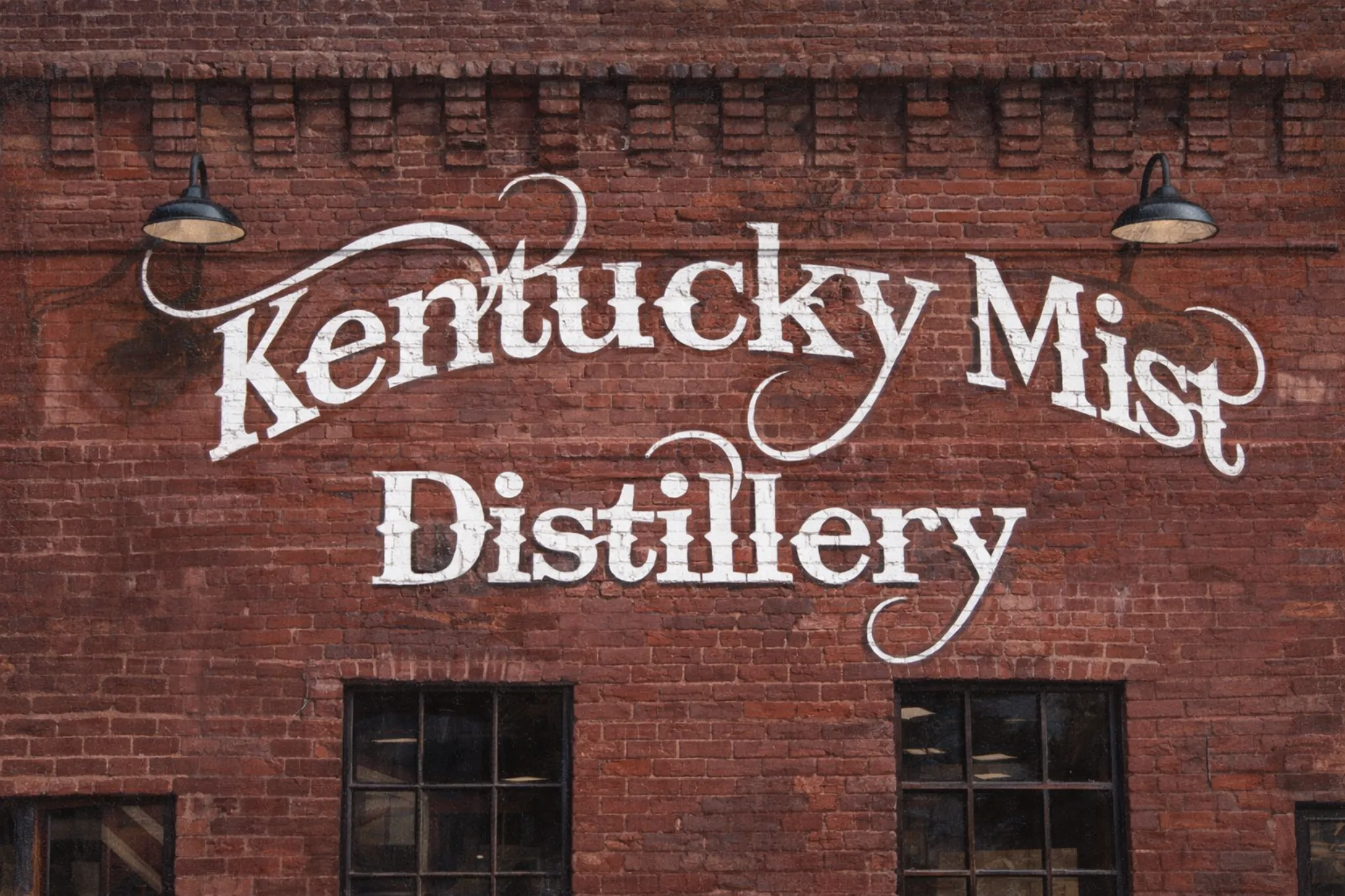 Kentucky Mist Distillery painted logo on a brick wall in Whitesburg, Kentucky.