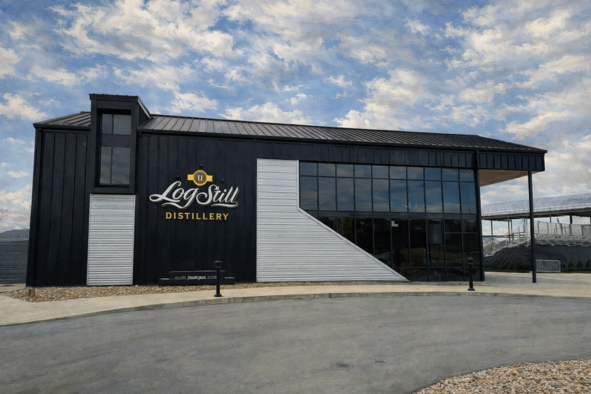 Exterior of Log Still Distillery in Kentucky with the Log Still Distillery sign on a modern black-and-silver building.