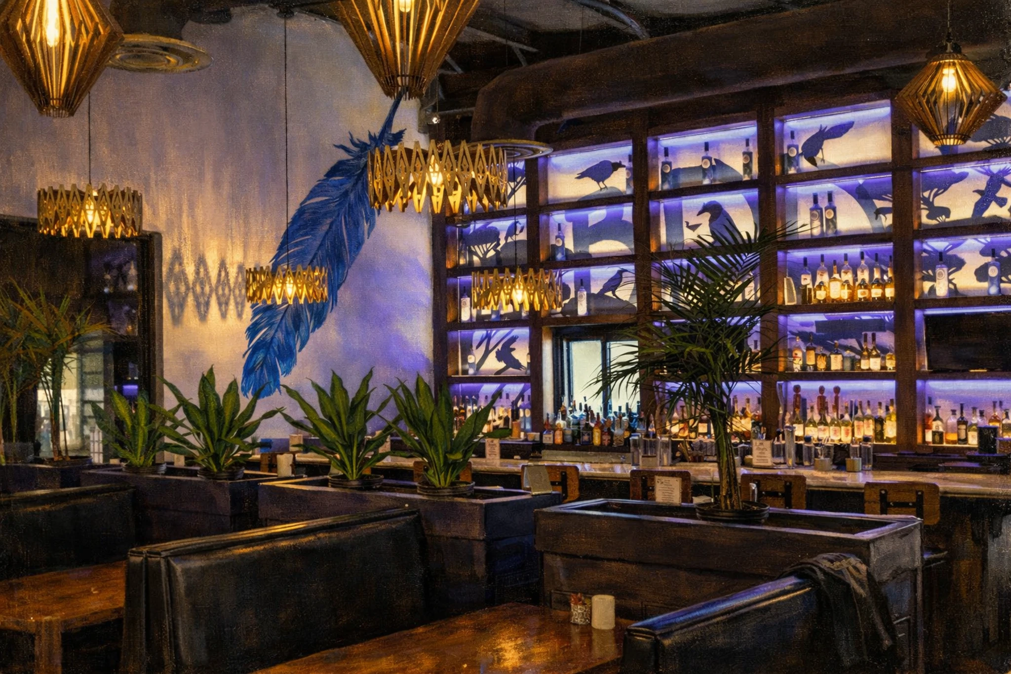 Modern bar and dining area at Blue Rook Distillery featuring illuminated bottle displays, pendant lighting, and indoor seating.