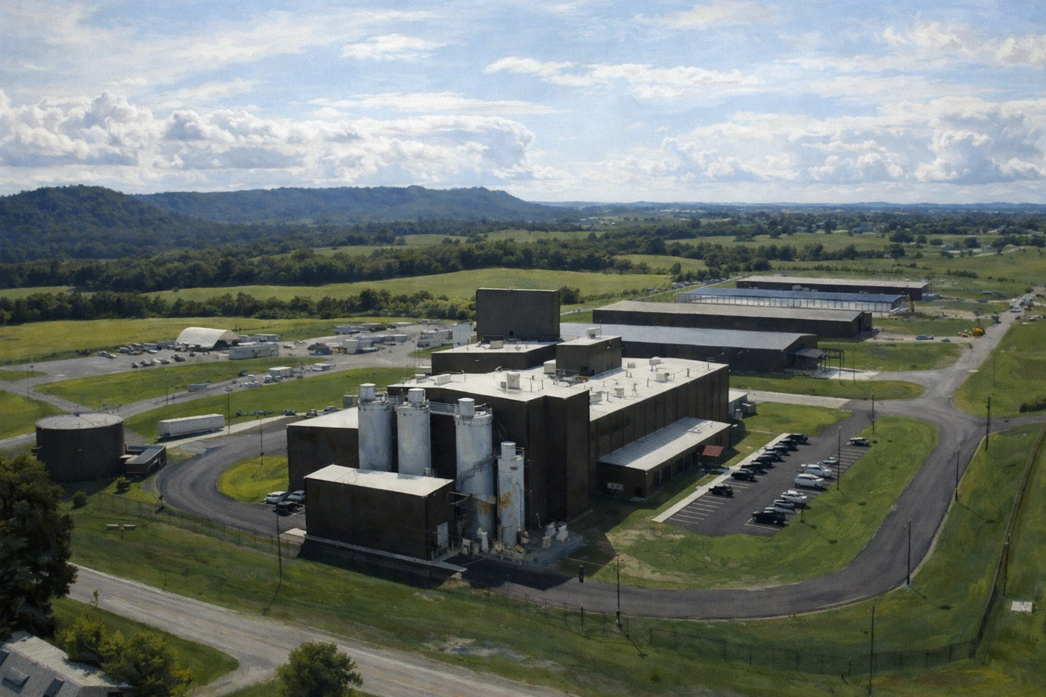 Wide aerial view of the Diageo distillery in Lebanon, Kentucky, featuring large production buildings, storage tanks, parking areas, and surrounding farmland.