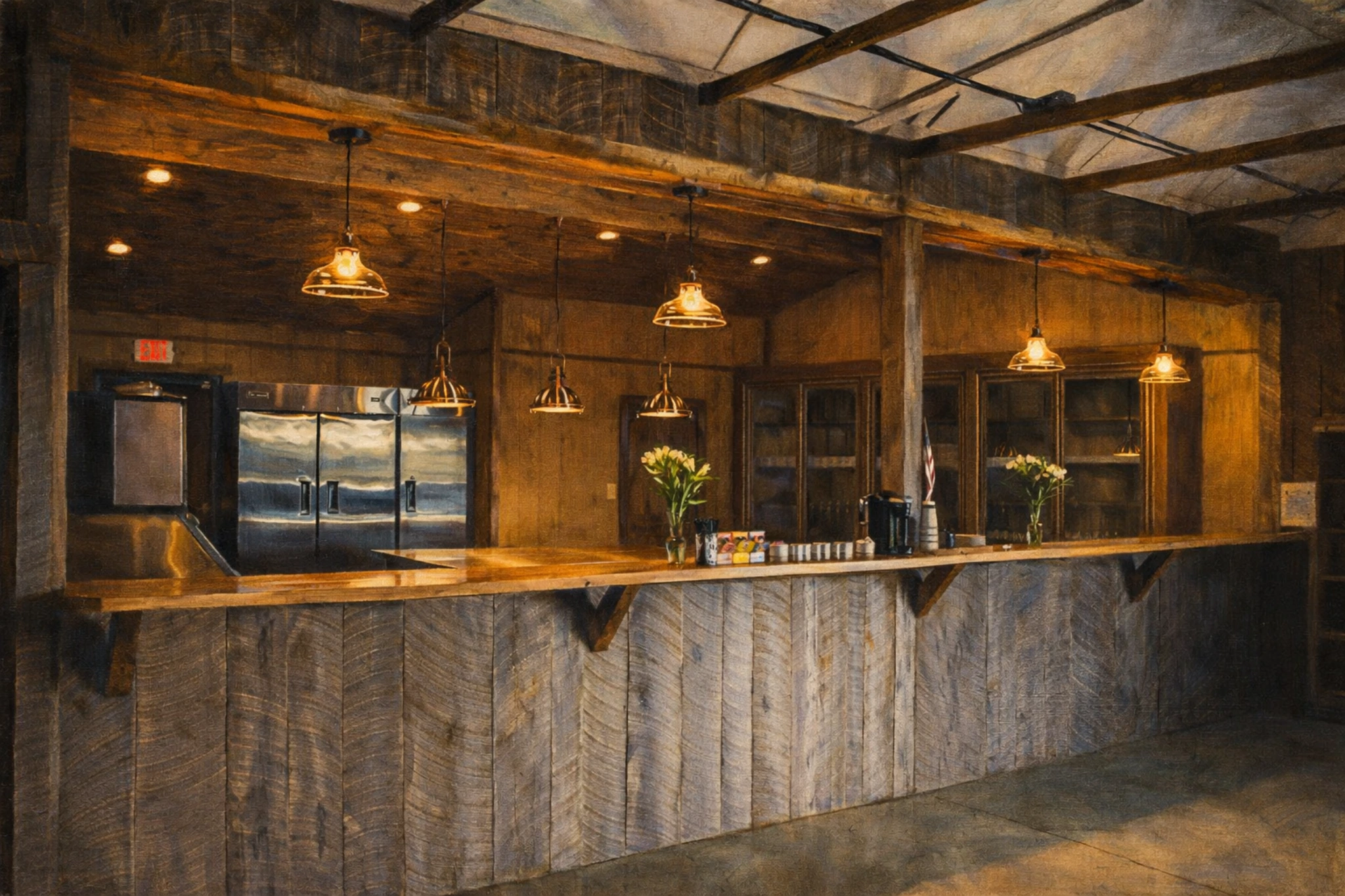 Interior bar at Preservation Distillery with a rustic wood counter, warm pendant lights, and stainless refrigerators behind the tasting area.