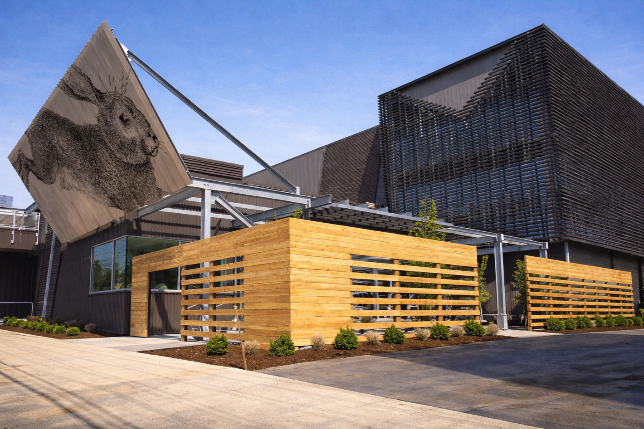 Exterior of Rabbit Hole Distillery displaying modern wood and metal architecture with a sculptural rabbit artwork.
