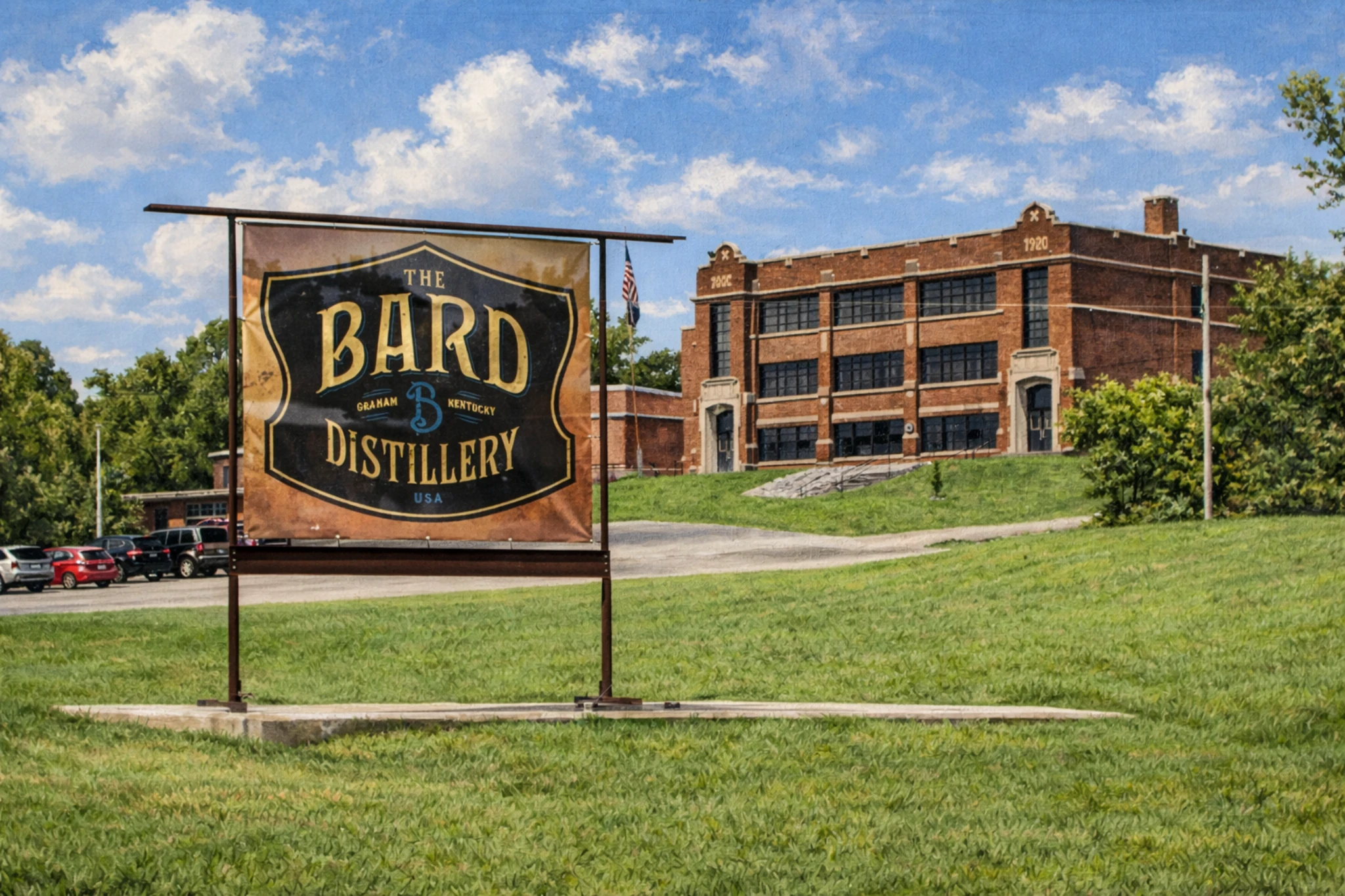 The Bard Distillery entrance sign displayed on a grassy lawn with the historic distillery building visible in the background.