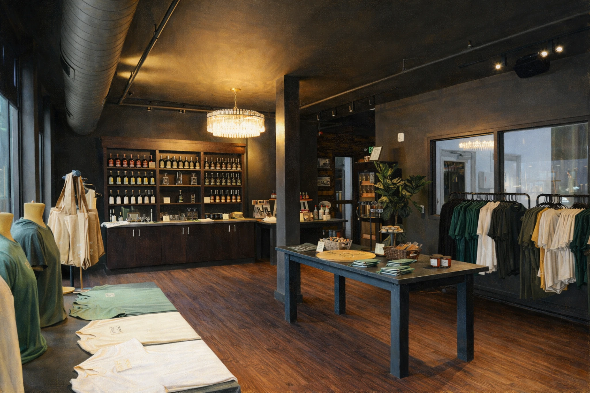 Interior of Wenzel Distillery gift shop featuring shelves of whiskey bottles, branded apparel, and merchandise displays.