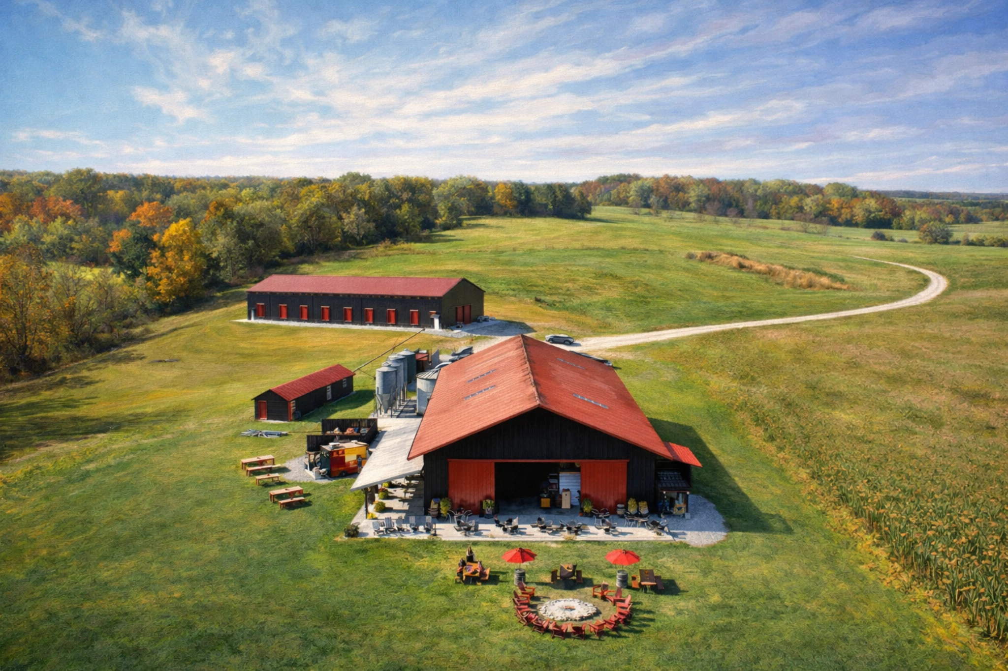 Aerial view of Whiskey Thief Distilling Co. showing red-roofed farm buildings, outdoor seating, and rolling countryside surrounding the distillery.