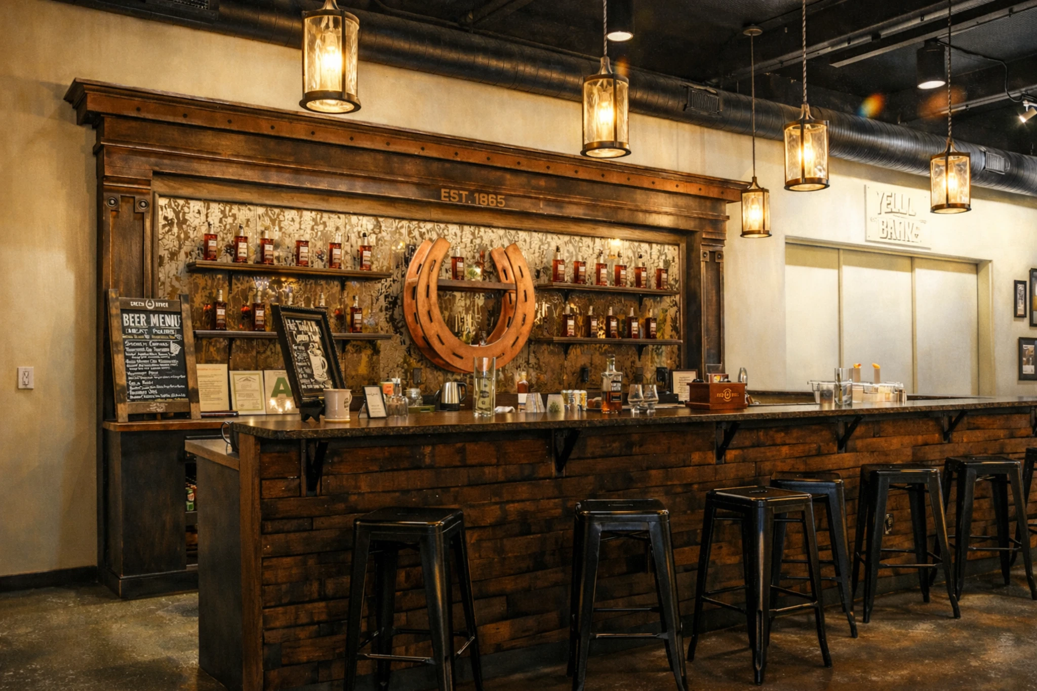 Bar area at Green River Distilling Co. in Owensboro, Kentucky, with a large horseshoe display, bottle shelves, and bar stools.